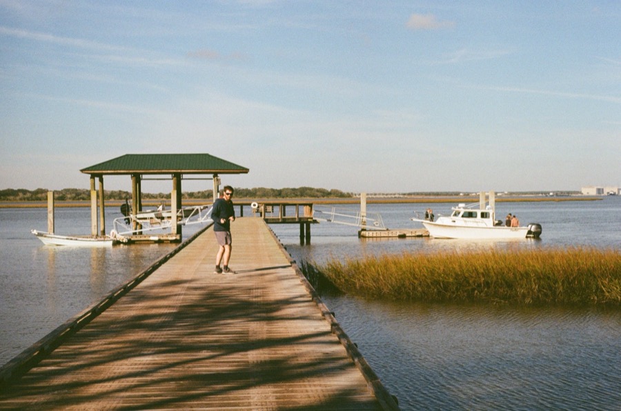Ledyard on the long wooden dock over the marsh